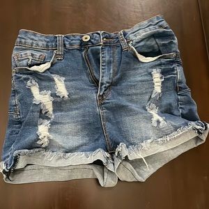 I’m selling these high rise shorts with rips on them.